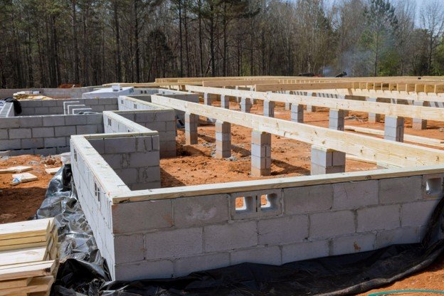 Concrete block foundation with floor framing system installed during new home construction in Eastlake, OH