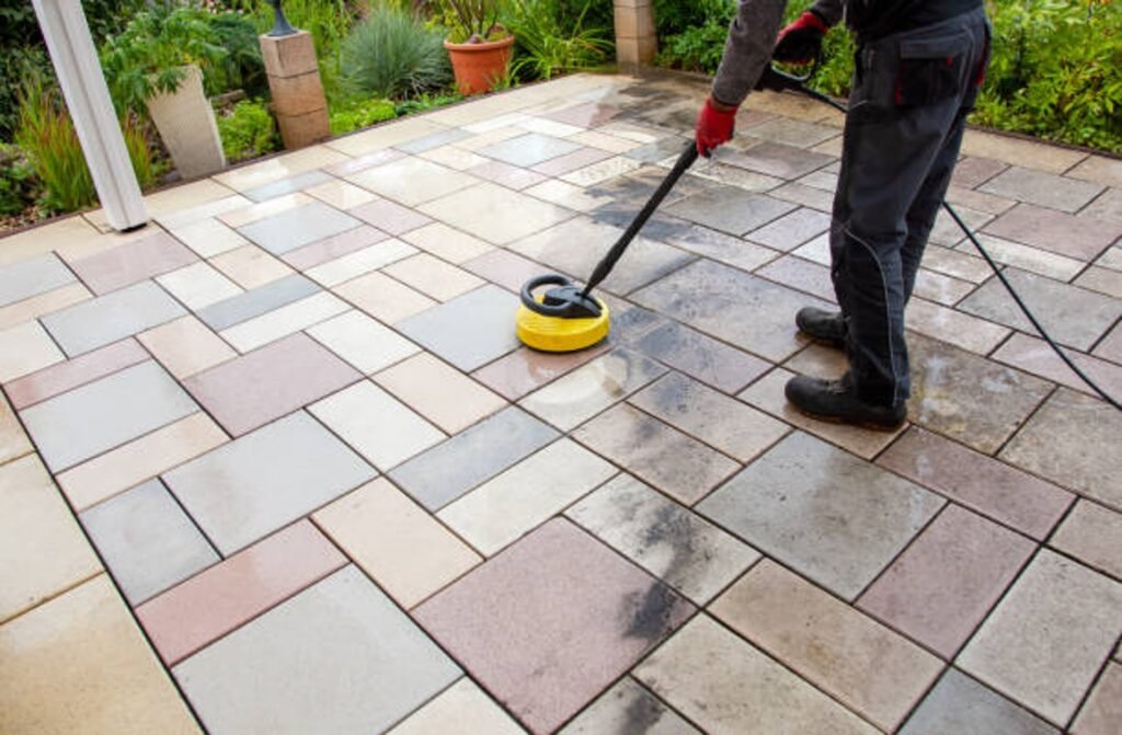 Cleaning and sealing decorative stamped concrete patio surface in residential backyard in Eastlake, OH