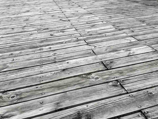 A old deck and worn out and broken.