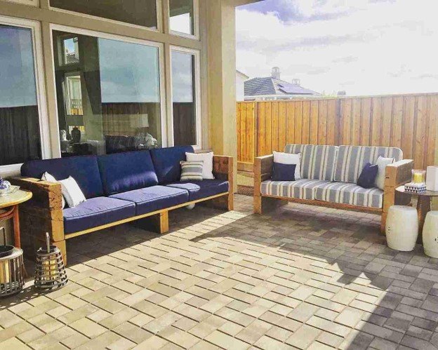A beautiful custom outdoor with coach and pillow on it.