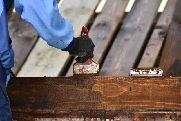 A man working on deck replacement.