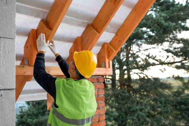 A inspector checking safety on pergola construction.